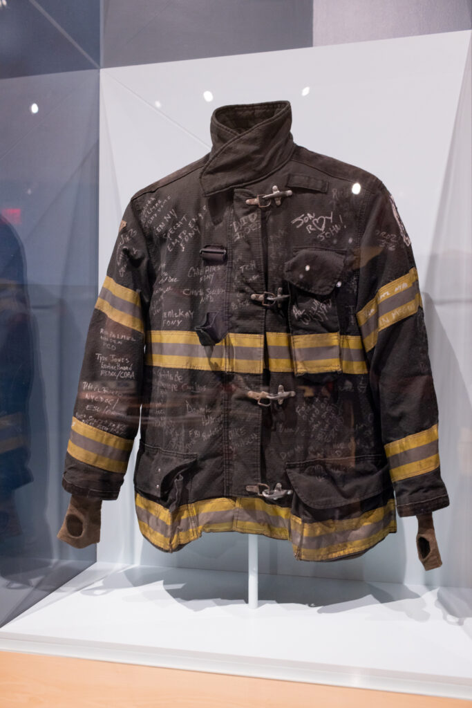 Bunker Coat signed by 9 11 Health Advocates Credit  9 11 Memorial Museum. Photo by Chris Jorda 683x1024 - 25 Years Later, The 9/11 Memories and Tributes Are Stronger Than Ever.